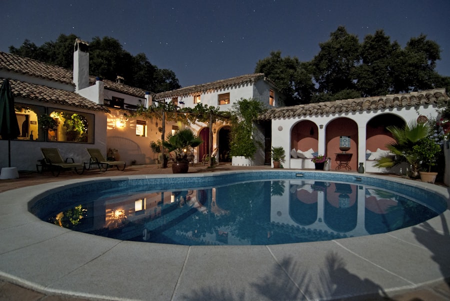 Villa garden and pool beautifully lit at night
