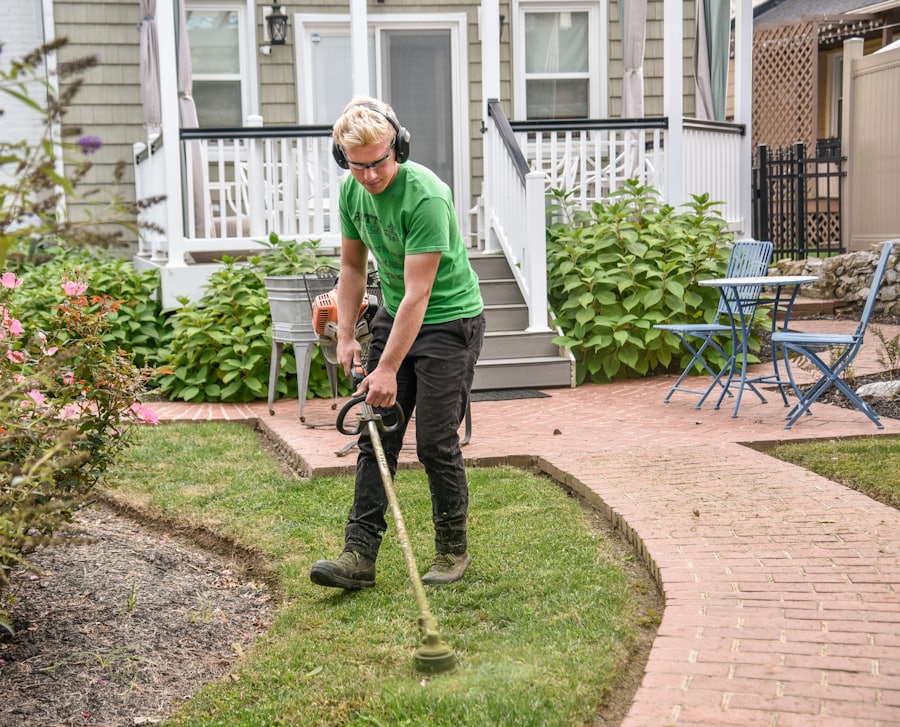 Professional gardener maintaining lawn and edges