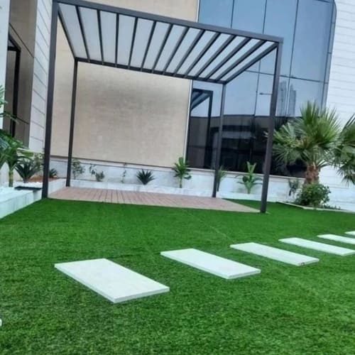 Artificial grass lawn installation with pergola and stepping stones — project 1
