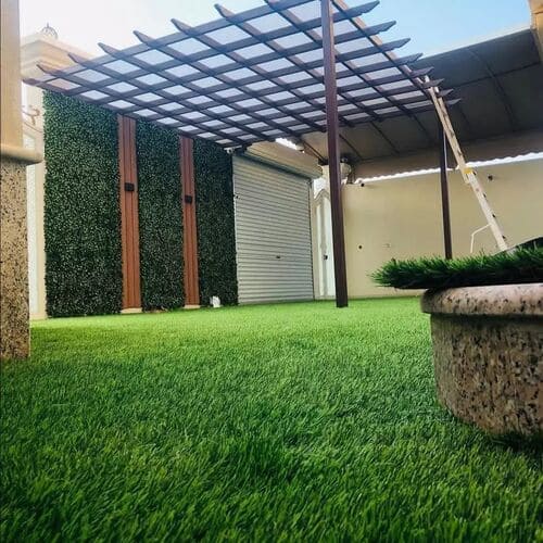 Artificial grass lawn installation with pergola and stepping stones — project 5
