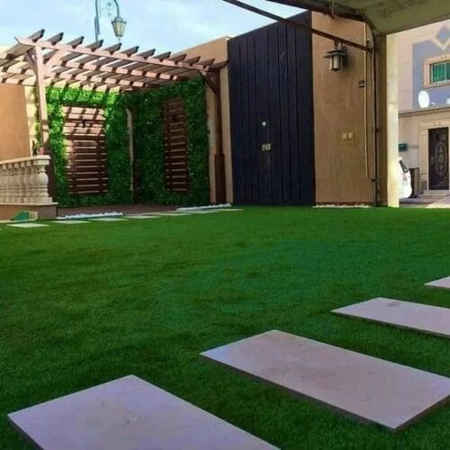 Artificial grass lawn installation with pergola and stepping stones — project 8
