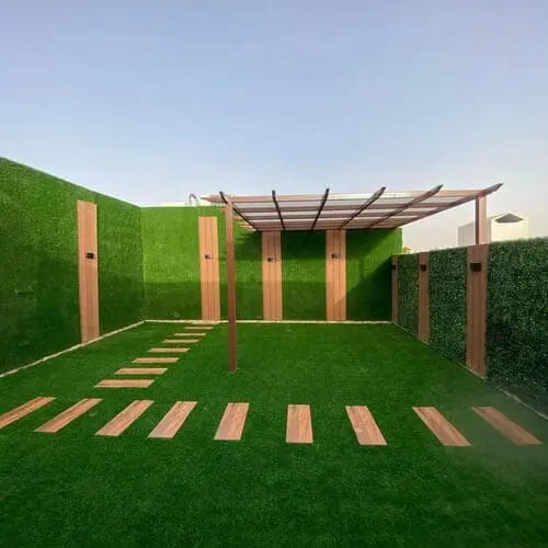 Artificial grass lawn installation with pergola and stepping stones — project 19