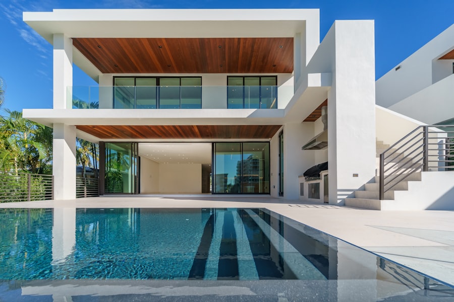 Modern villa with designed garden and pool at dusk